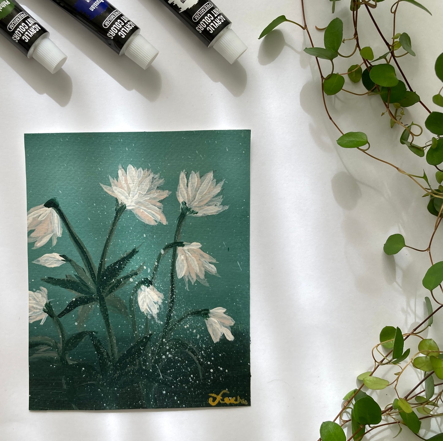 White flower on green